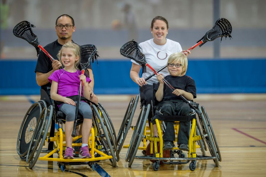 Children in wheelchairs playing lacrosse