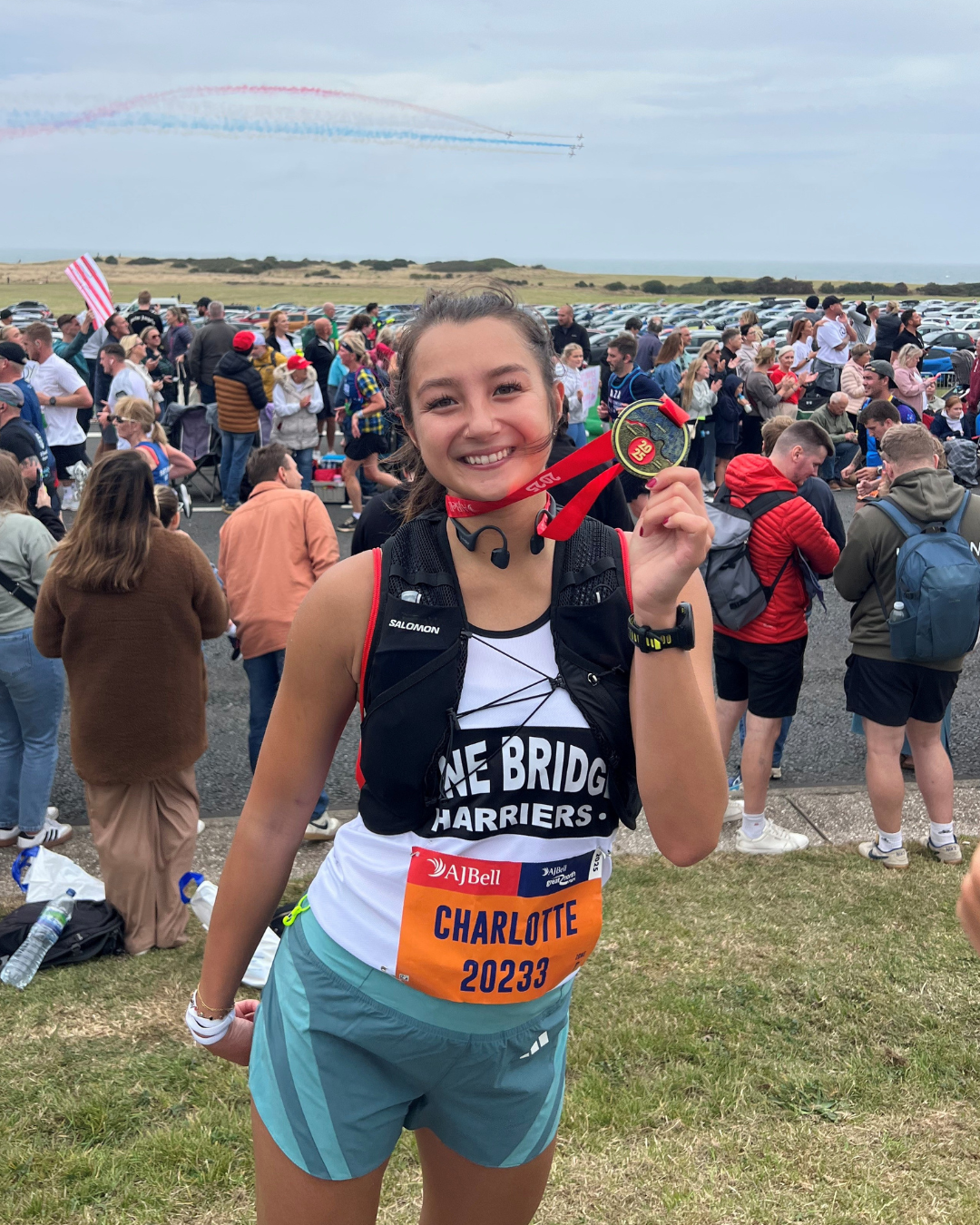 Charlotte holding her medal at the Great North Run