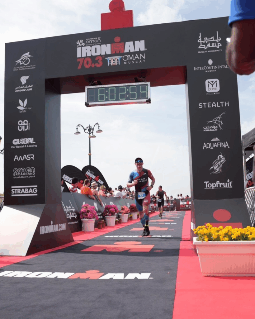 Andy crossing the finishing line of Iron Man 