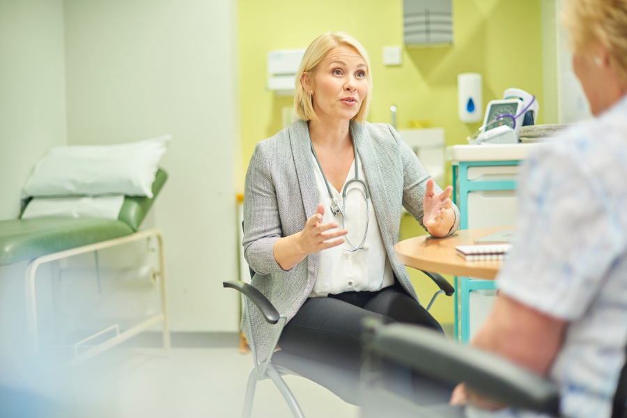 GP advising a patient in a clinic